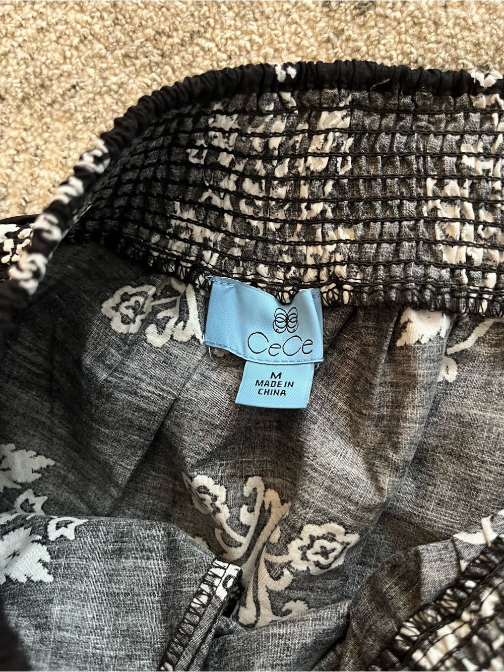 CeCe cotton poplin A-line midi skirt in black with a white botanical print. - Picture 4 of 7